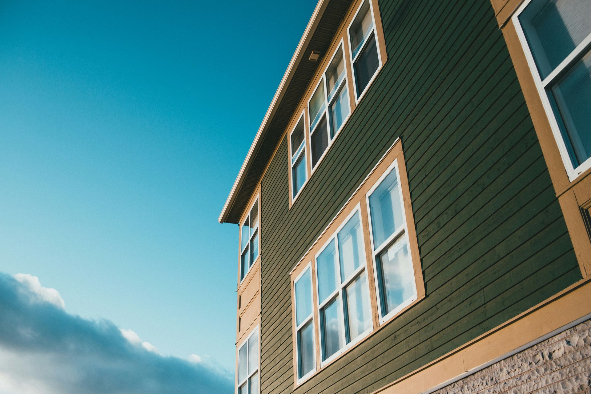 brown and white concrete building under blue sky during daytime